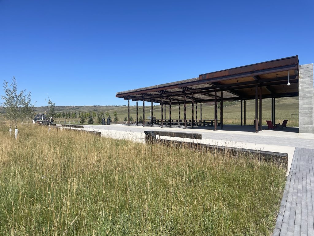 A wide angle photo of an area where people can rest at Haskayne Legacy Park in Calgary