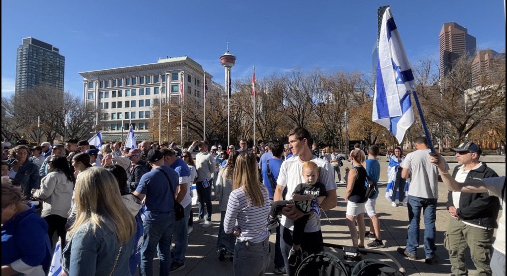 Dozens rally outside the Municipal building in Calgary on Monday, Oct. 9, 2023. (Silvia Naranjo, CityNews image)