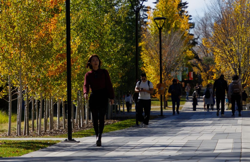 Students at the University of Calgary walk along the grounds in Calgary