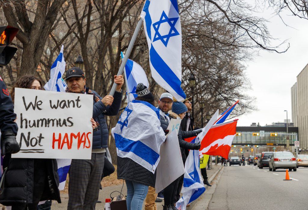 People rally in support of Israel by Olympic Plaza in downtown Calgary
