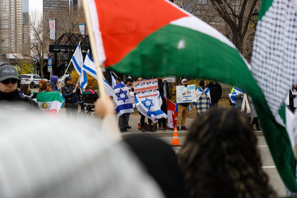 People rally in support of Palestine and Israel in front of the Municipal building and by Olympic Plaza in downtown Calgary