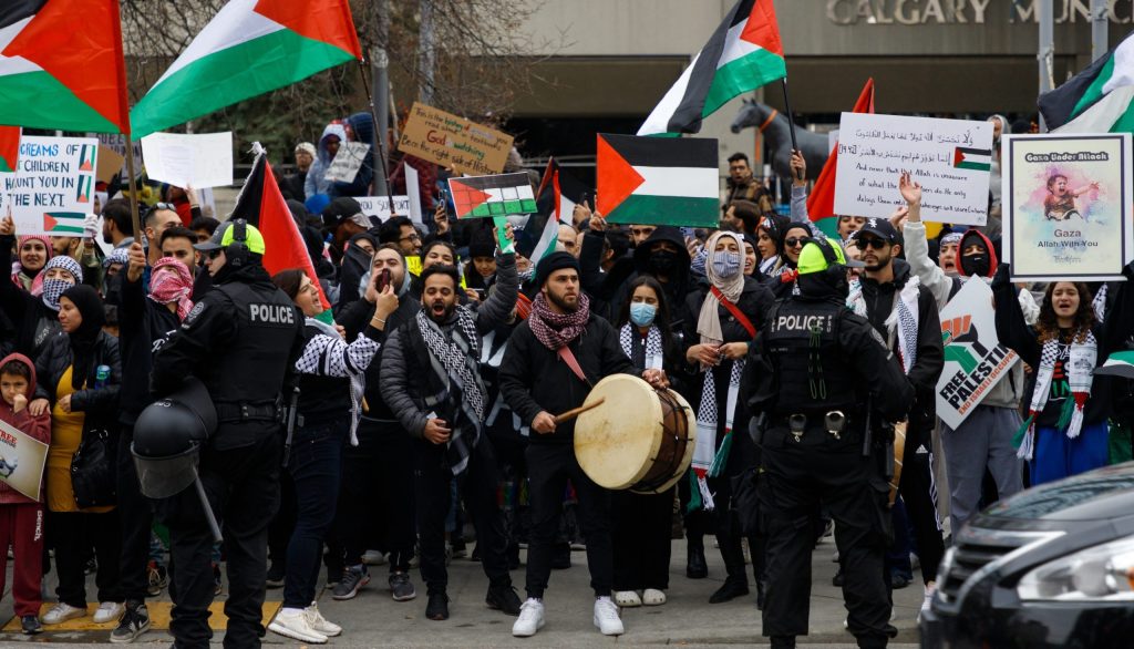 People rally in support of Palestine in front of the Municipal building in downtown Calgary