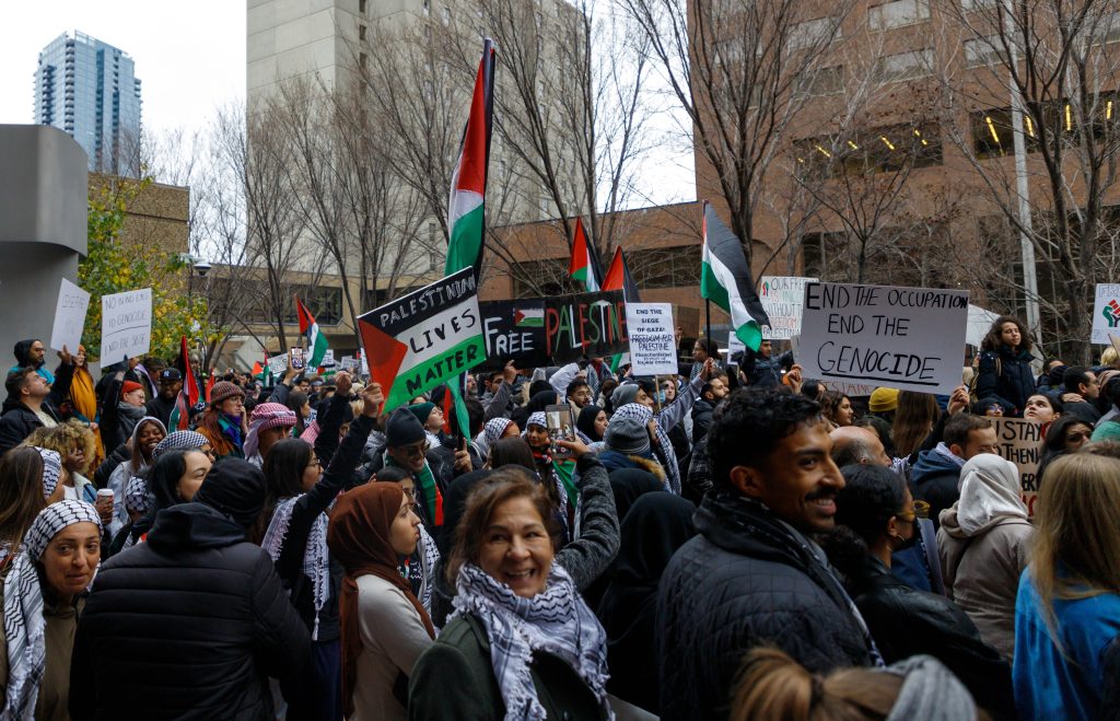 People rally in support of Palestine in front of the Harry Hays Building in downtown Calgary