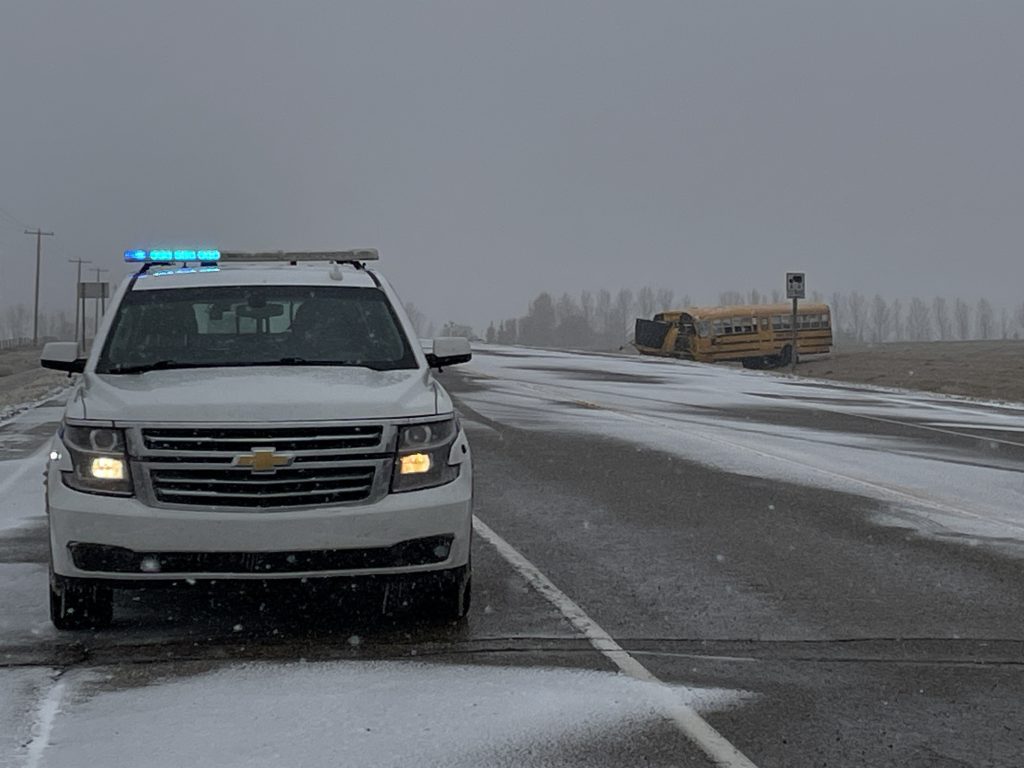 Five students and one adult were left with non-life threatening injuries after a school bus rolled on Highway 2A Monday morning. (Nick Blakeney, CityNews image)