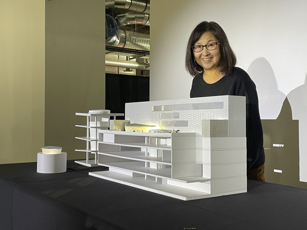 Maya Lin. a globally recognized artist, is to design the rooftop terrace for the Glenbow Museum in Calgary. Lin is pictured with renderings of her project on Oct. 26, 2023