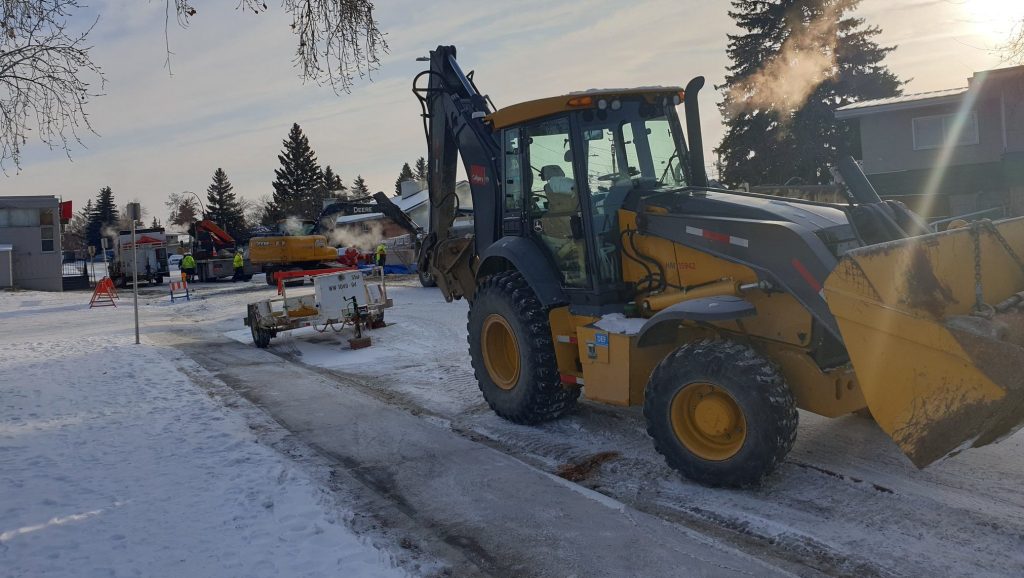 City of Calgary crews work to fix a water main break in the northeast