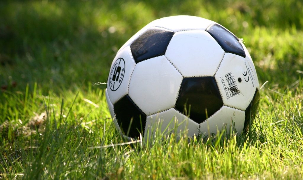 A soccer ball sits on a grass field. (CityNews file image)