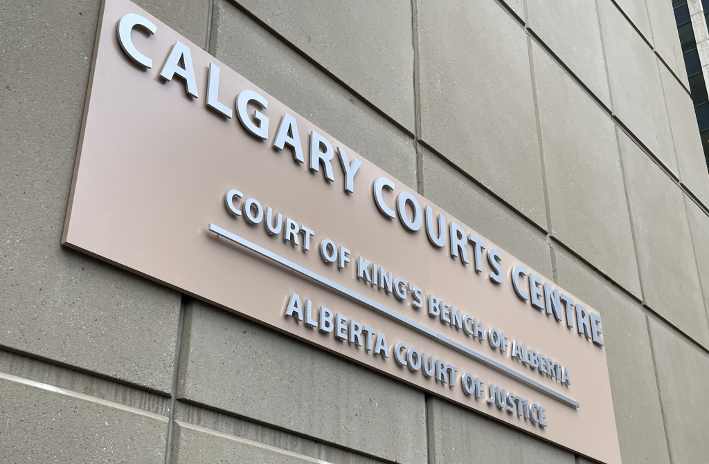 A photo of a sign of Calgary Courts Centre: Court of King's Bench of Alberta, in downtown Calgary