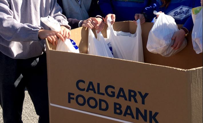 A Calgary Food Bank donation box is filled with goods