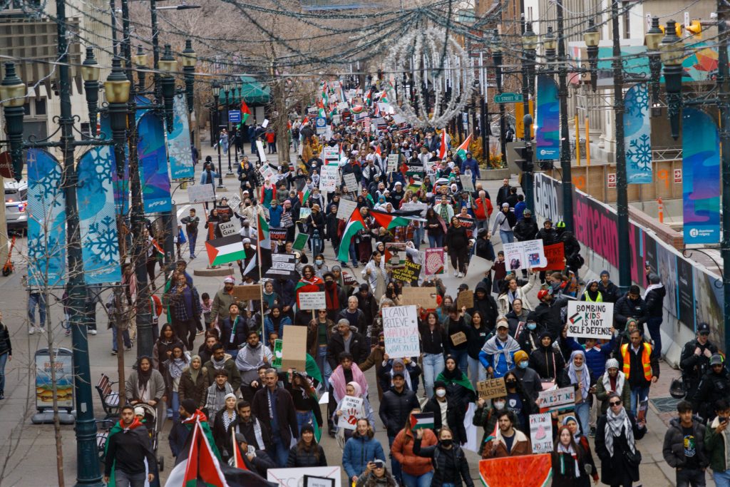 Pro-Palestine protestors march onto Stephen Avenue in Calgary