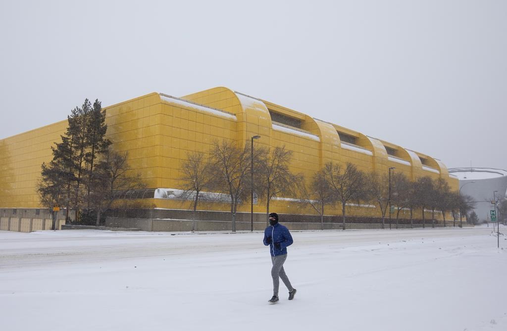 A jogger runs past the University of Alberta Butter Dome in Edmonton