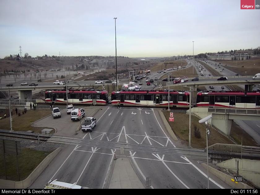 Calgary police say one person is in life-threatening condition and another person is in stable condition after a collision between a vehicle and a CTrain at Memorial Drive and Deerfoot Trail Friday.