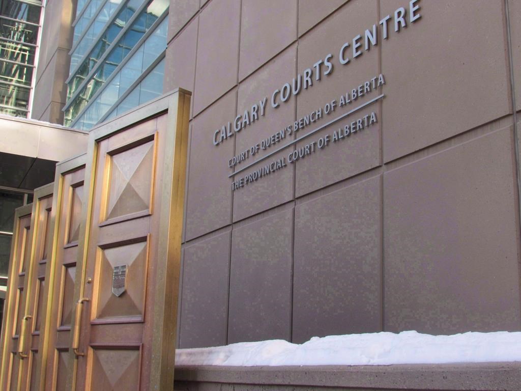 The sign at the Calgary Courts Centre in Calgary is shown on Friday.