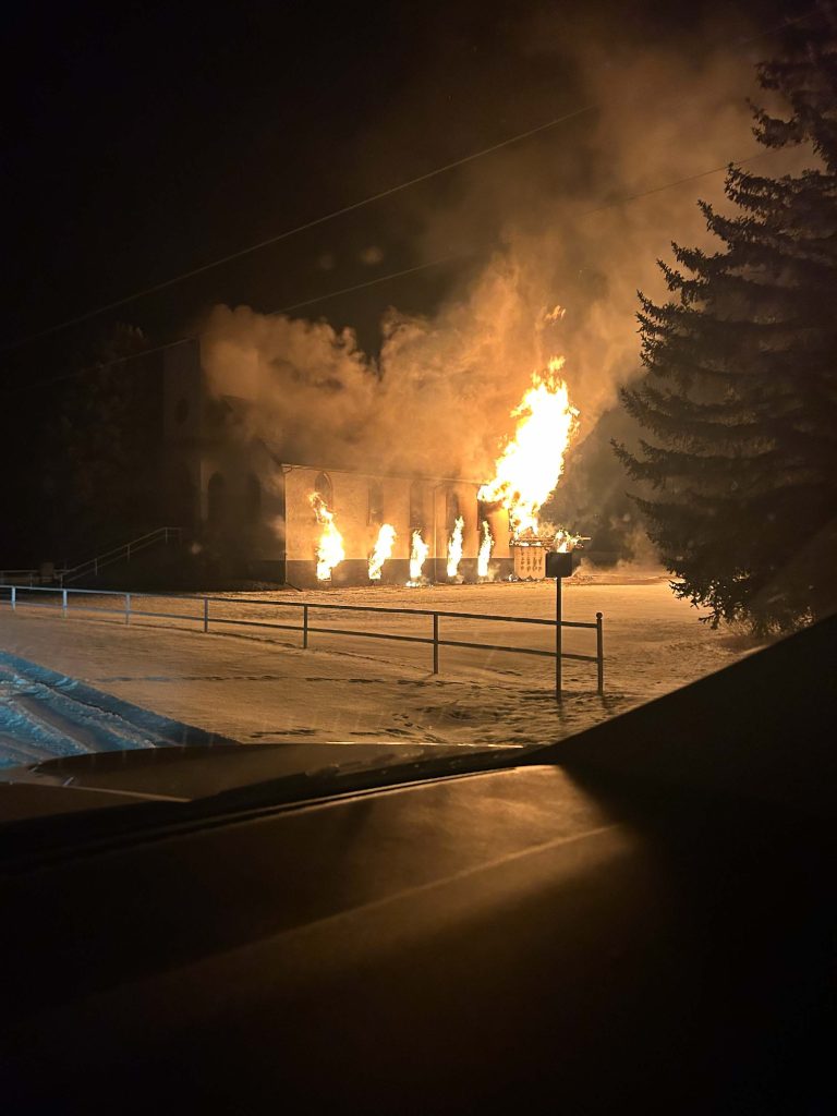 The Beiseker Seventh Day Adventist Church engulfed in flames in Wheatland County, Alta, on Wednesday, Dec. 20, 2023.