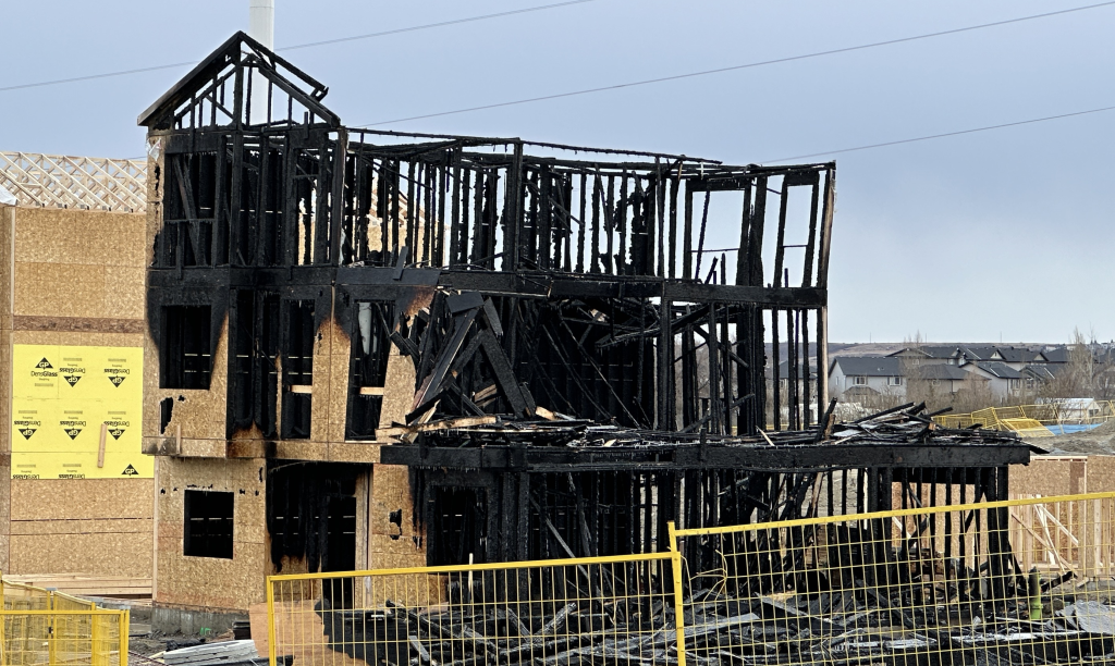 The remains of a home damaged by a fire at Sage Hill Terrace in Calgary