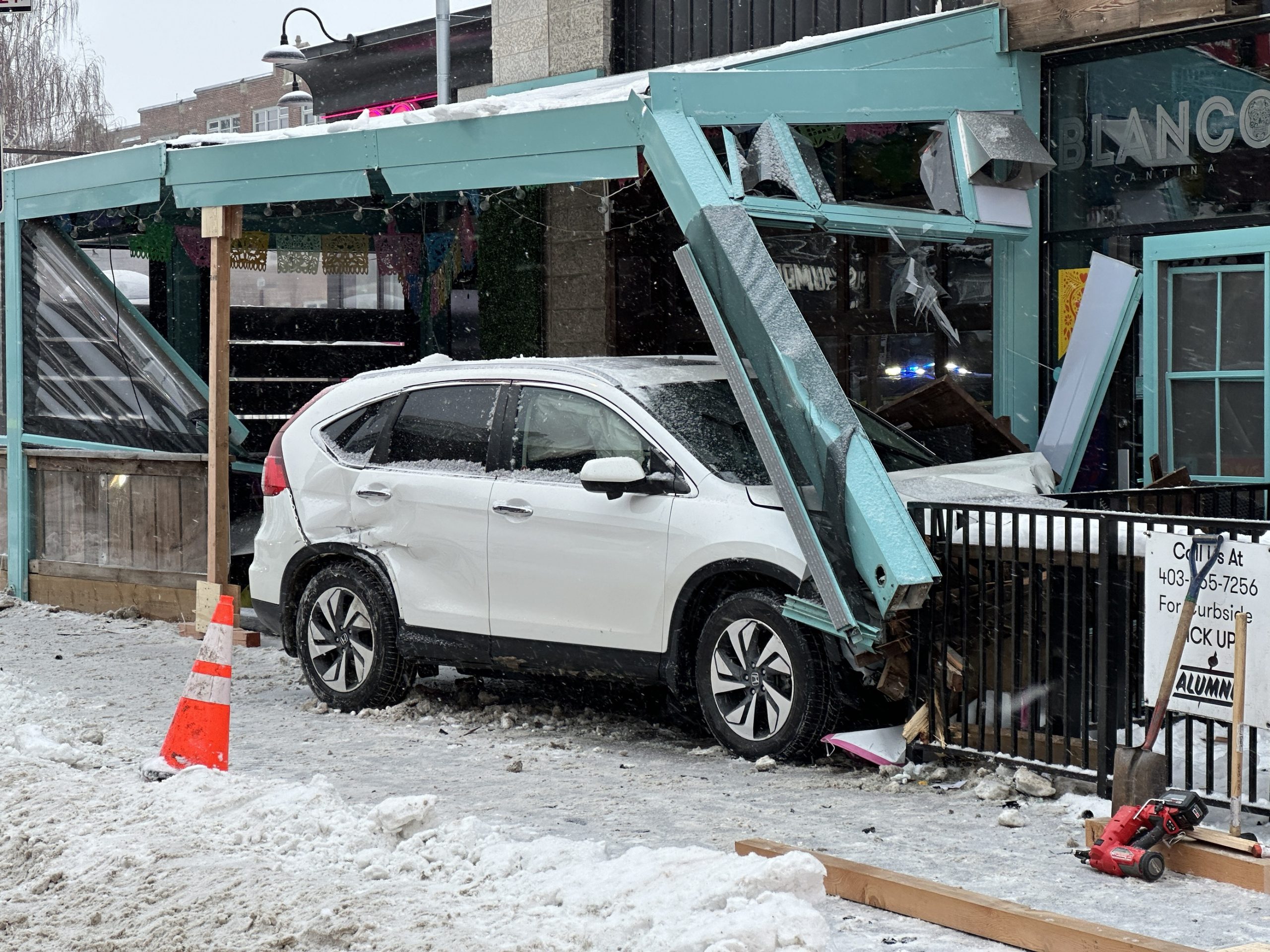 Road re opens after vehicle crashes into building on Calgary s 17