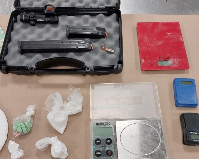 More than $110,000 in drugs, cash, and loaded guns were seized from a downtown Calgary home following an investigation into drug trafficking that began last year. (Courtesy Calgary Police)