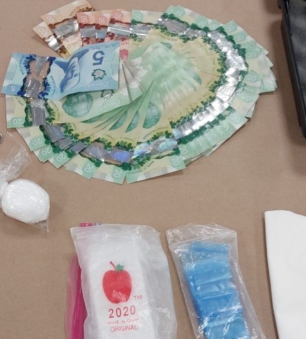 More than $110,000 in drugs, cash, and loaded guns were seized from a downtown Calgary home following an investigation into drug trafficking that began last year. (Courtesy Calgary Police)