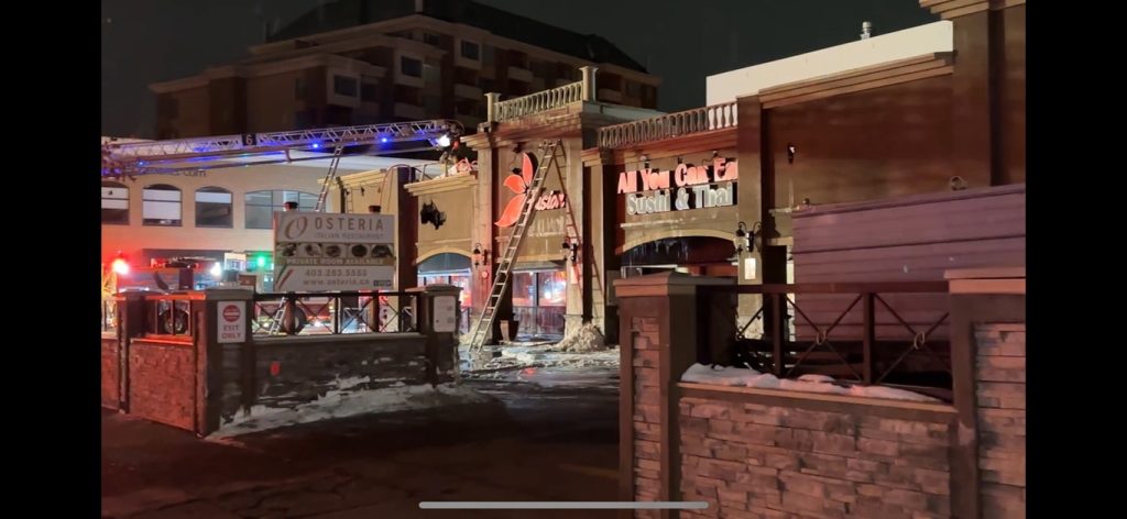 Dozens of firefighters and numerous engines packed the streets in Calgary's Kensington Monday night, as the roof of a restaurant went up in flames. (Nick Blakeney, CityNews image)