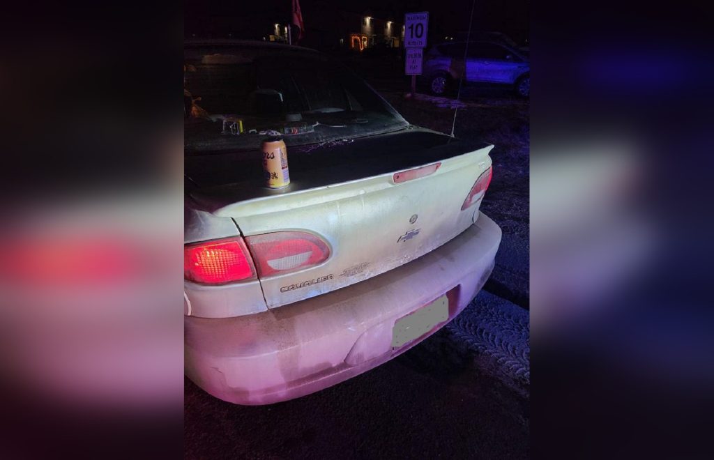 A Cavalier with a beer can on trunk