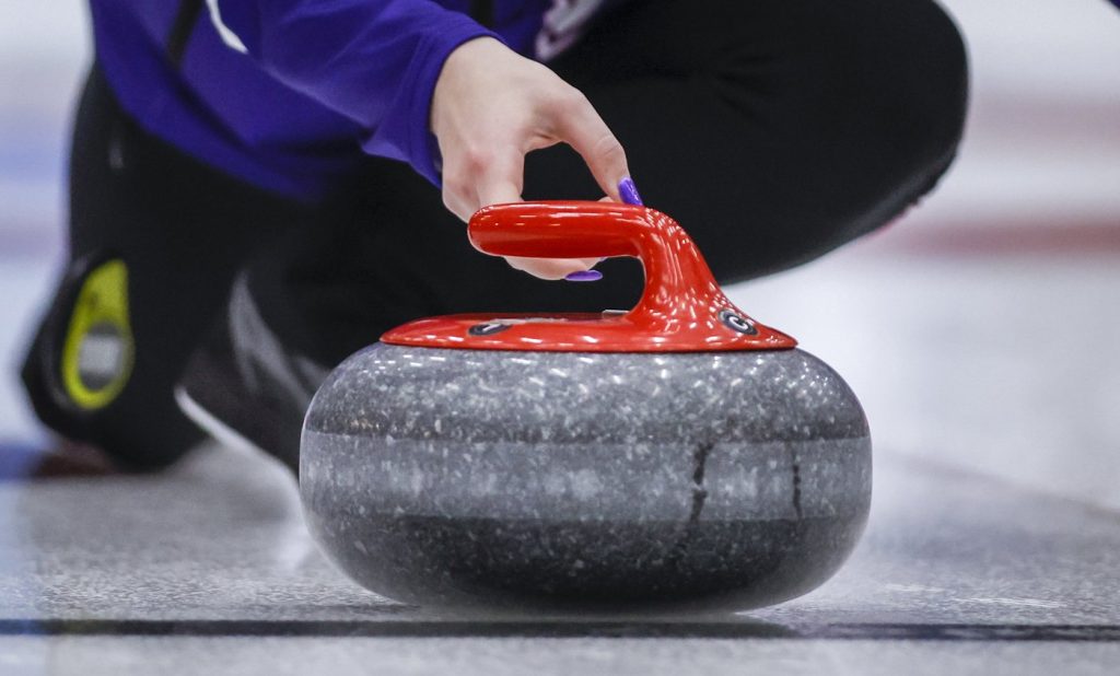 A rock crosses the hog line at the Scotties Tournament of Hearts in Calgary, Monday, Feb. 19, 2024. The honour system is in play at the Canadian women's curling championship when it comes to hog-line violations. THE CANADIAN PRESS/Jeff McIntosh