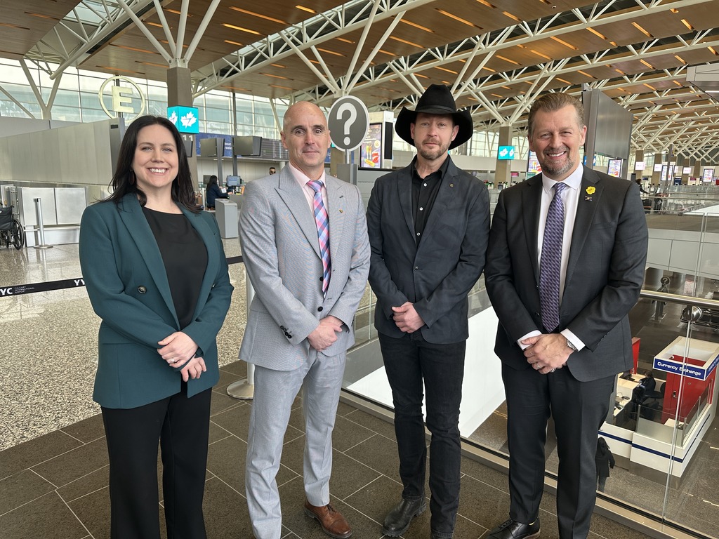 (L-R) Kate Price, executive director for Action Coalition for Trafficking (ACT) Alberta, James McLean, a research and policy director at the Canadian Centre to End Trafficking, Paul Brandt, co-chair, Alberta Office to Combat Trafficking in Persons, and Minister of Public Safety and Emergency Services, Mike Ellis, at the Calgary International Airport on Thursday, Feb. 22, 2024. (Jillian Code, CityNews image)