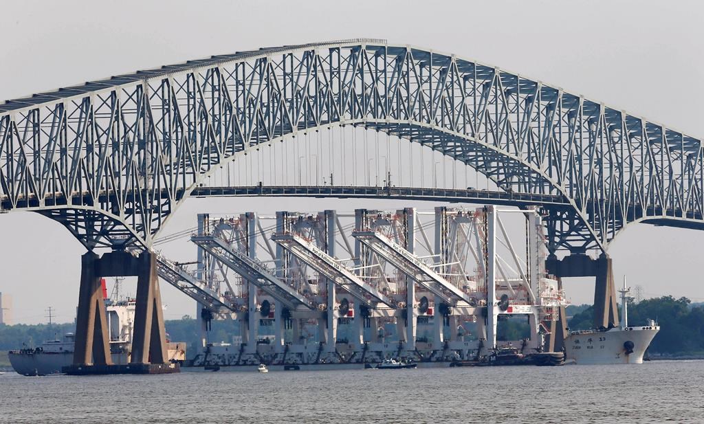 Cargo ship hits Baltimore’s Key Bridge, bringing it down. Rescuers are looking for people in water