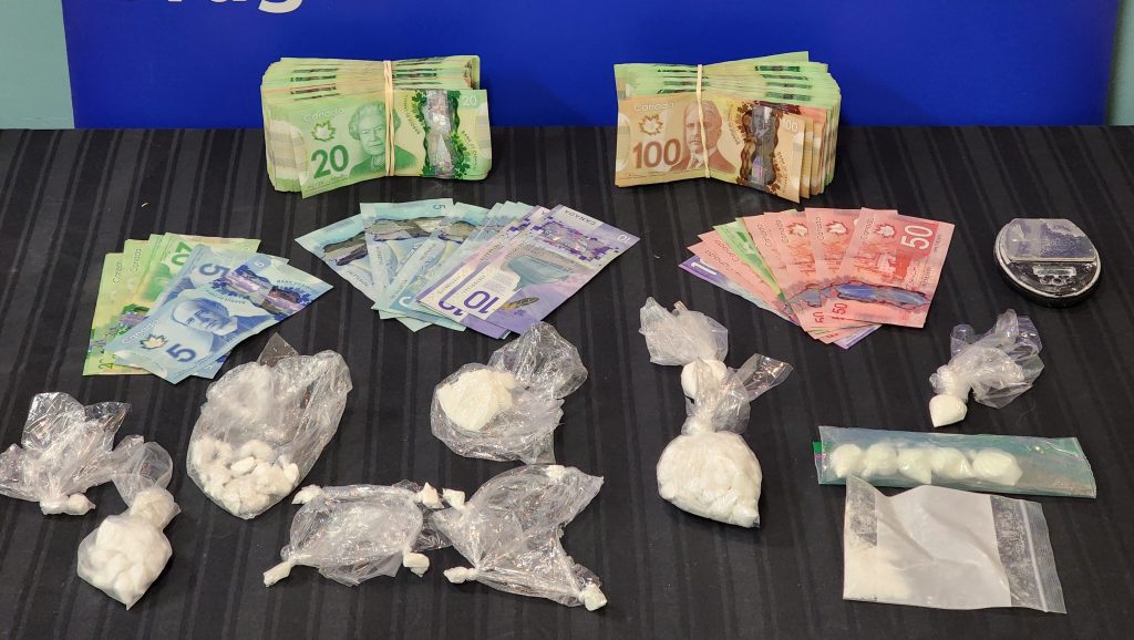 Cocaine, drug paraphernalia, and nearly $25,000 seized by Grande Prairie RCMP on March 14, 2024.