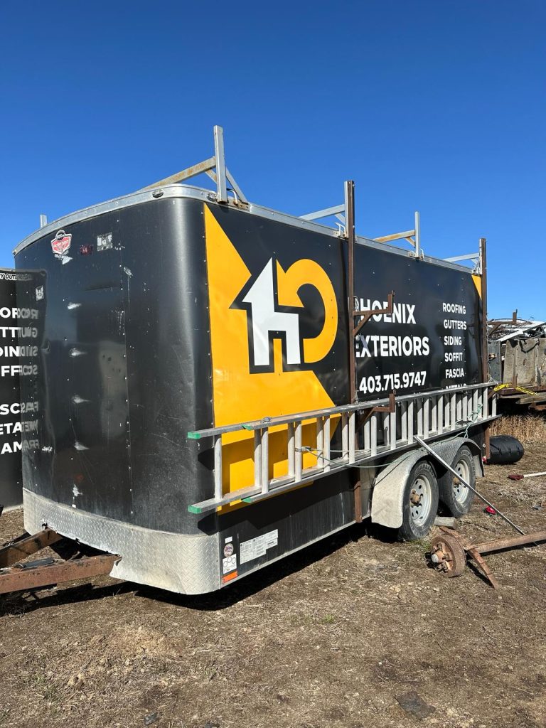 Police officers found 12 stolen pick-up trucks, a stolen travel trailer, two stolen utility trailers, and two stolen dirt bikes at a rural property in Vulcan County on April 9, 2024. A thirty-year-old man from Okotoks is now facing charges. (Courtesy RCMP)