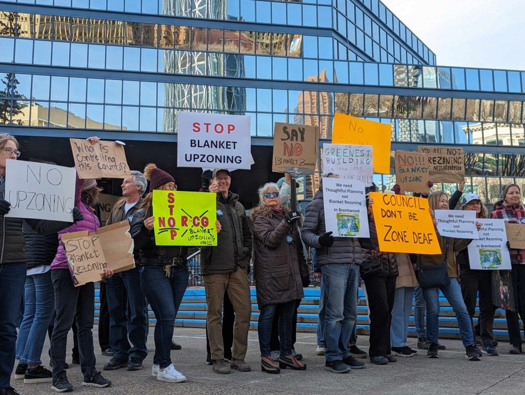Residents protest outside the Calgary Municipal Building on April 22, 2024, ahead of a marathon hearing on proposed blanket rezoning. (Reese Tenhove.)