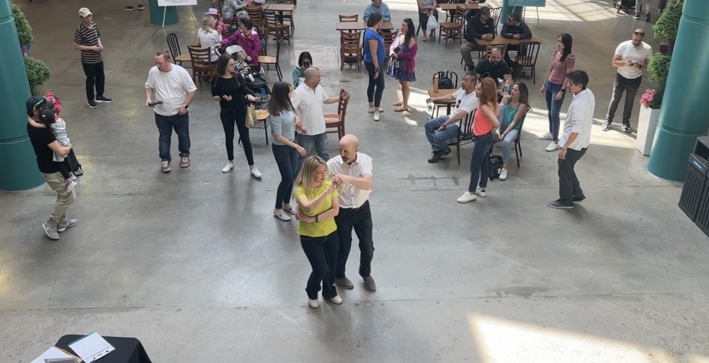 People dance inside Eau Claire Market amid a farewell celebration of the mall on Saturday, May 11, 2024.