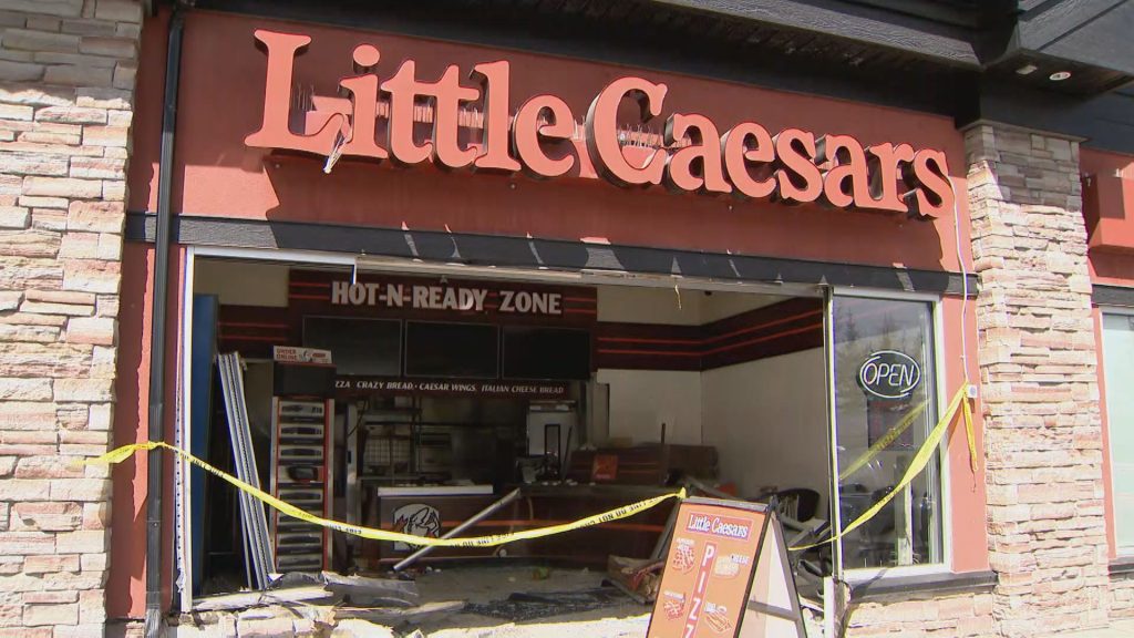 Driver crashes through storefront of pizza place in NW Calgary