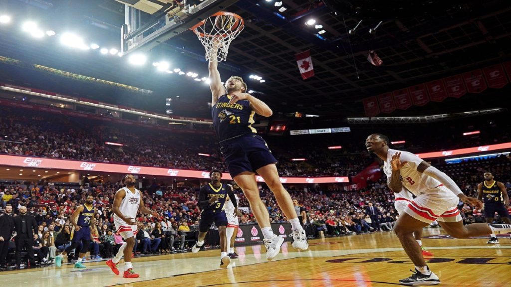 Edmonton Stingers' Ben Krikke (21) dunks against the Calgary Surge during CEBL basketball action in Calgary in this Tuesday, May 21, 2024 handout photo. THE CANADIAN PRESS/HO, CEBL