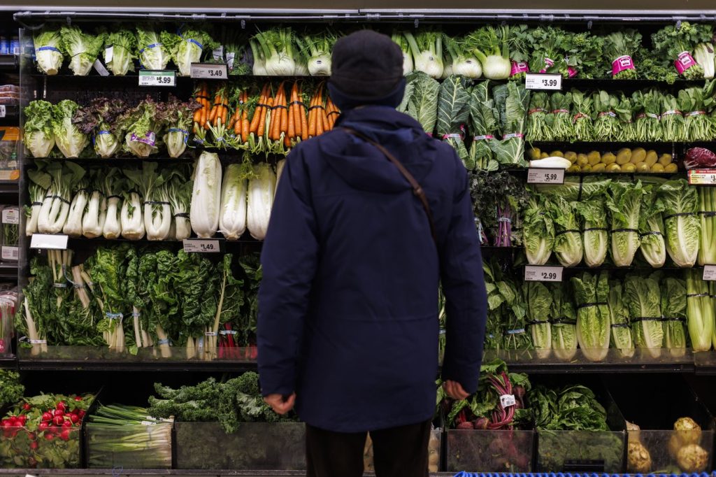 Food inflation ticked higher in Canada in May for the first time in nearly a year. A customer shops in the produce section at a grocery store In Toronto