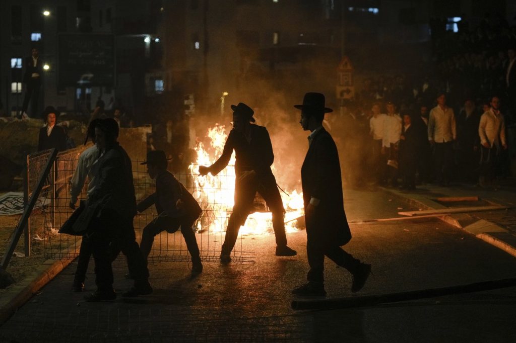 Ultra-Orthodox protest against order to enlist in Israeli military turns violent in Jerusalem