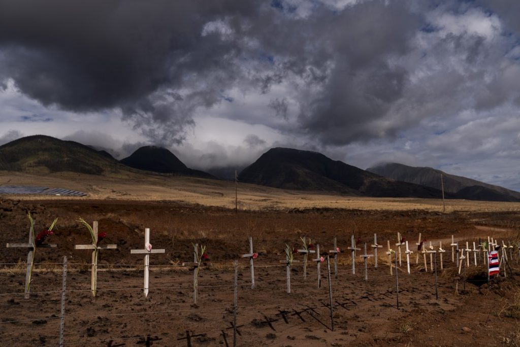 When wind-driven wildfires broke out on the Hawaiian island of Maui last summer, killing more than 100 people and destroying 2,200 buildings, many local residents didn't know the extent of the disaster for days. Crosses honoring victims killed in a recent wildfire are posted along the Lahaina Bypass in Lahaina, Hawaii, Aug. 21, 2023. Evacuation orders in Lahaina were complicated by a telecommunications blackout, caused by the downing of all cellular and landline fibre and copper lines.