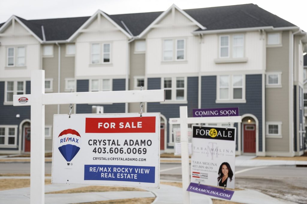 Houses for sale are shown in a new subdivision in Airdrie, Alta