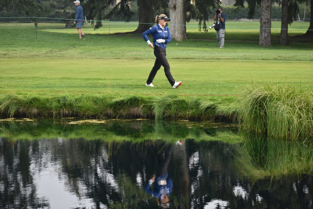 Canada's Brooke Henderson and her reflection during her first round at the CPKC Women's Open in Calgary on July 25, 2024. (Sandra Prusina, 660 NEWS)