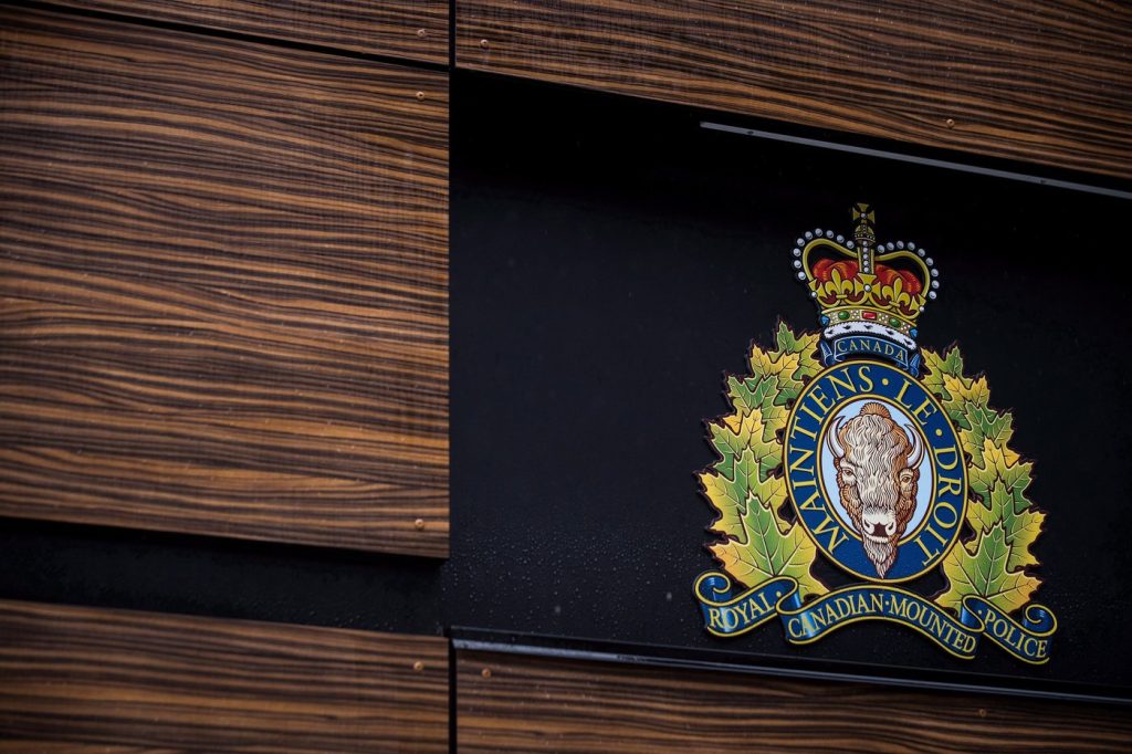 The RCMP logo is seen outside Royal Canadian Mounted Police "E" Division Headquarters, in Surrey, B.C., on Friday April 13, 2018