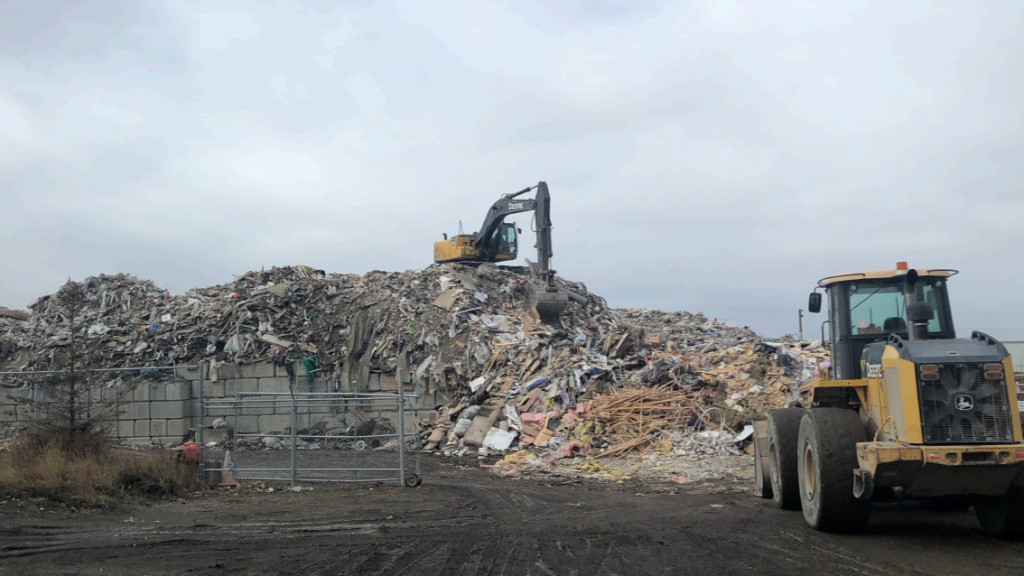 Crews at work at a temporary recycling facility in Calgary.