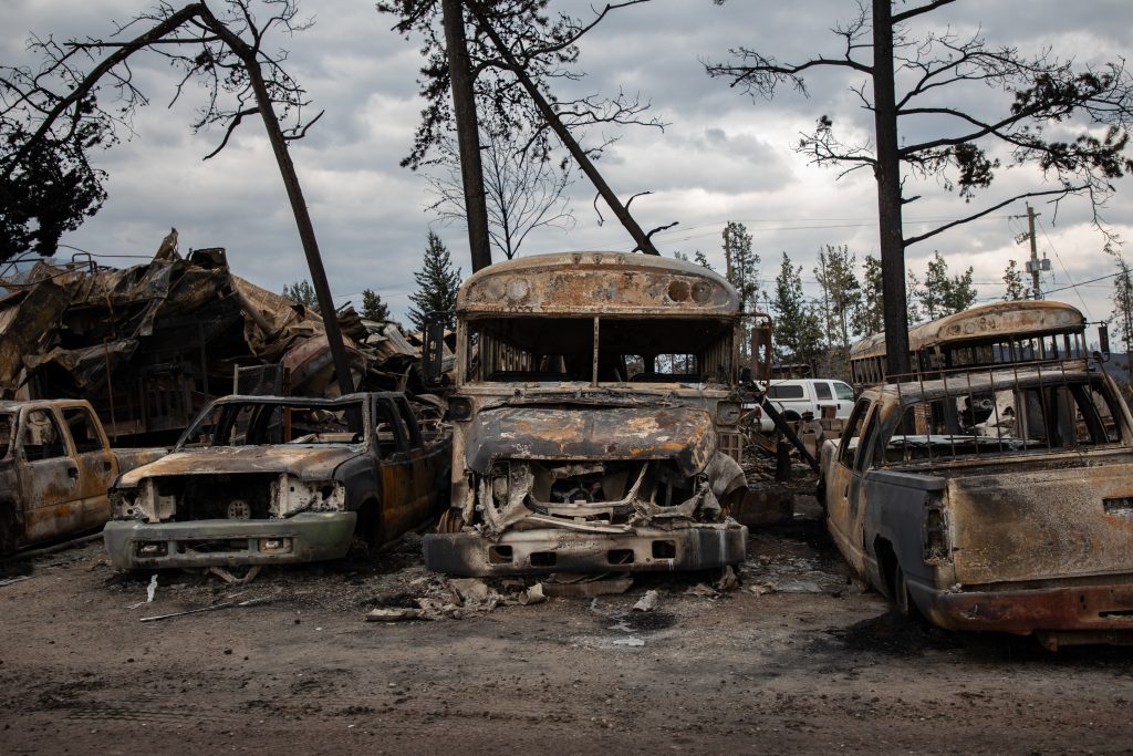 Burnt buses and cars in Jasper, Alta., on July 26, 2024. The public school division for the town is racing to clean up schools damaged by wildfires. THE CANADIAN PRESS/Amber Bracken