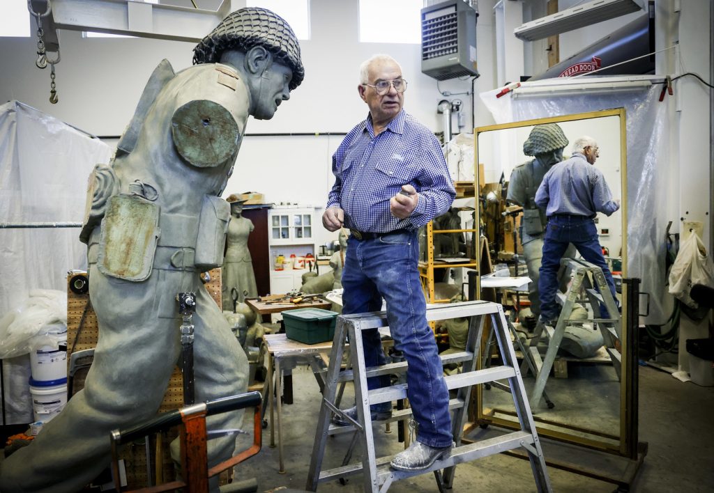 Bronze sculptor Don Begg, makes adjustments to an eight-foot bronze statue depicting a World War II Canadian Soldier, will be receiving the Alberta Order of Excellence for his work over the decades and is pictured in his workshop in Cochrane, Alta.