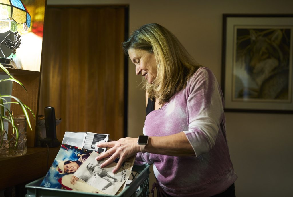 Brenda Barge looks through photos of her father Ron Barge, creator of the children’s show Buck Shot in Calgary