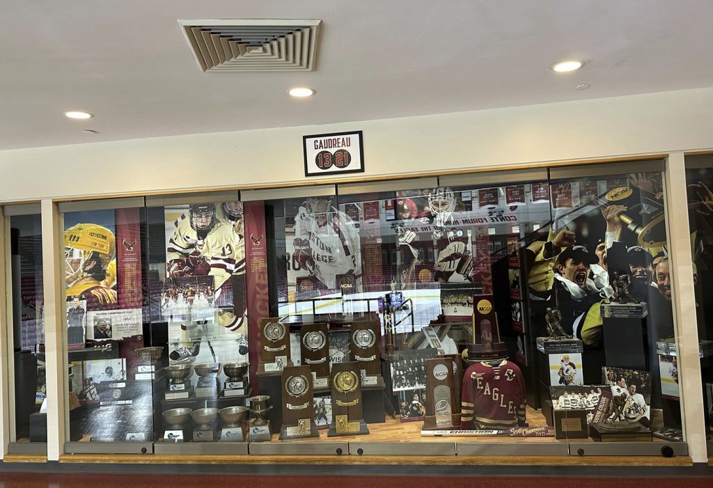 A sign hangs above the trophy case at Boston College's Conte Forum mourning the deaths of former Eagles hockey players Johnny and Matthew Gaudreau in Boston, Wednesday, Sept. 4, 2024