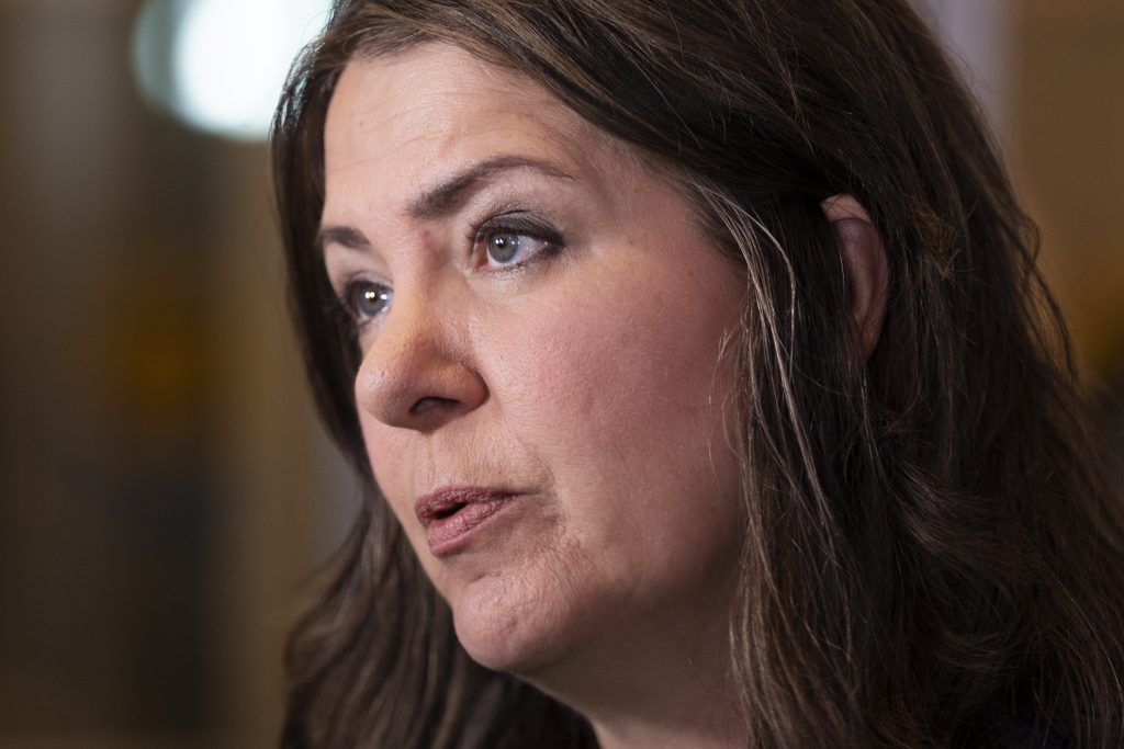 Alberta Premier Danielle Smith is expected to announce her government's plan to help K-12 classrooms being squeezed by an influx of new families. Smith speaks with reporters before a meeting in Halifax, Monday, July 15, 2024. THE CANADIAN PRESS/Darren Calabrese