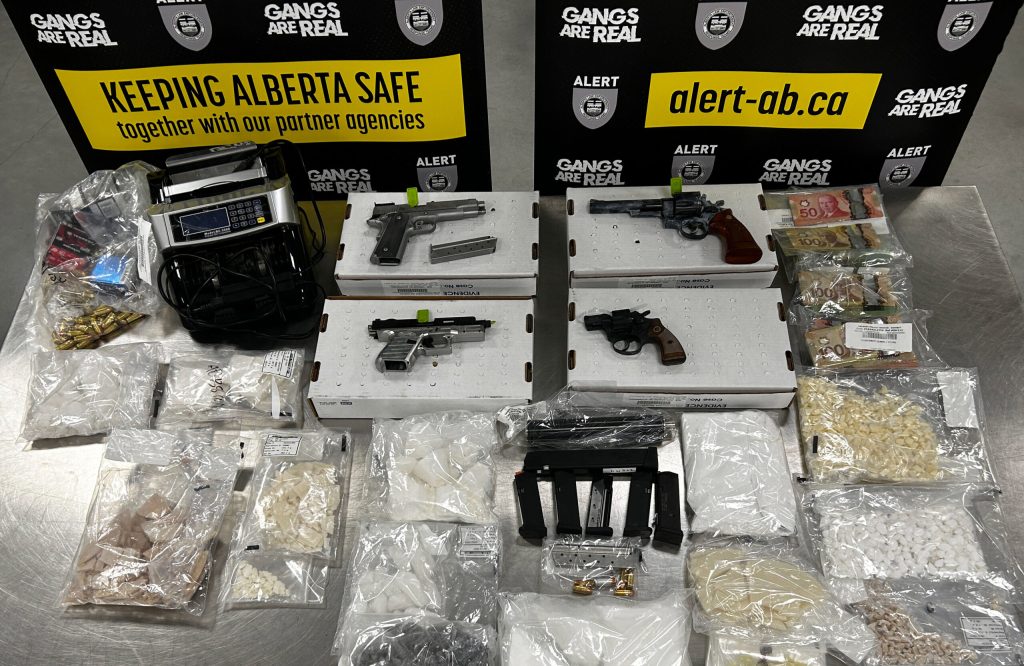 Thousands of dollars worth of drugs, guns, cash seized from Calgary homes