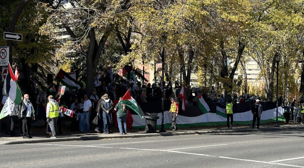 Counter-protestors organized by the Calgary Palestine Council gather at Olympic Plaza in downtown Calgary on Sunday, Oct. 6, 2024. They are counter-protesting amid a remembrance service hosted by member's of Calgary Jewish community.