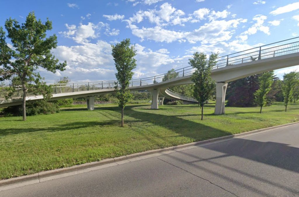 A pedestrian bridge in Calgary's West Hillhurt community now bears the name of a former city councillor who brought the project to fruition. (City of Calgary)