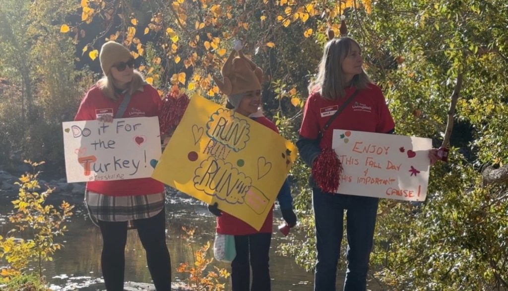 People cheer on participants for the 31st annual Alzheimer Walk and Run at Prince's Island Park in Calgary on Sunday, Oct. 13, 2024.