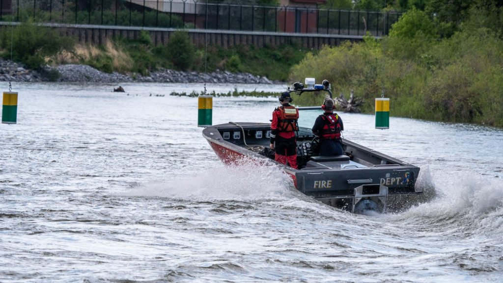 The Calgary Fire Department rescue boat patrols the Bow River